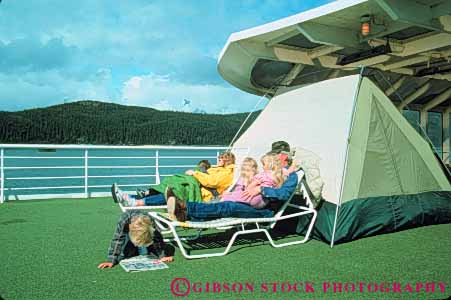 Stock Photo #10391: keywords -  alaska camp camped camping deck families family ferries ferry group groups horz juneau near passenger passengers people public ride riding ship ships state tent tents transport transportation transporting
