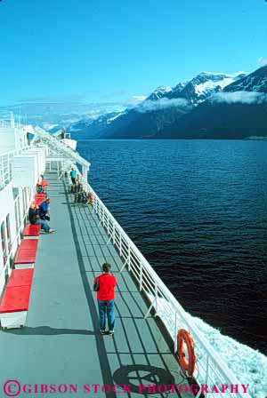 Stock Photo #10392: keywords -  alaska ferries ferry juneau near passenger passengers people public ride riding ship ships state transport transportation transporting vert