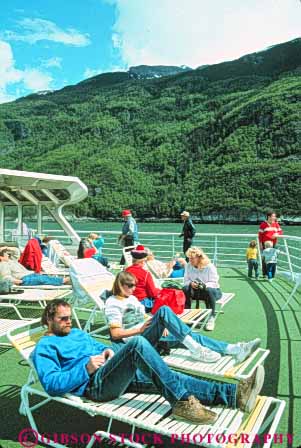 Stock Photo #10393: keywords -  alaska ferries ferry juneau near passenger passengers people public relax relaxed relaxes relaxing ride riding ship ships state sunny sunshine transport transportation transporting vert