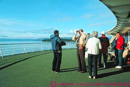 Stock Photo #10394: keywords -  alaska ferries ferry horz juneau near passenger passengers people public ride riding ship ships state transport transportation transporting
