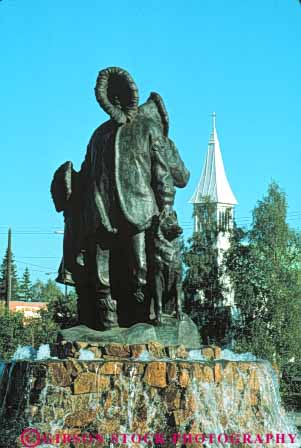 Stock Photo #10437: keywords -  alaska american eskimo eskimos fairbanks indian metal monument native sculpture statue statues vert