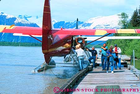 Stock Photo #10450: keywords -  adventure adventures airplane airplanes alaska backcountry explore exploring float floating floats fly flying horz juneau landscape lodge man men nature near passenger passengers people planes remote seaplane taku tour tourist tourists traveler travelers trip unloading wild wilderness