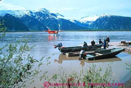 Stock Photo #10451: keywords -  adventure adventures airplane airplanes alaska backcountry explore exploring float floating floats fly flying greeting horz juneau landscape lodge man men nature near passenger passengers people planes remote seaplane taku tour tourist tourists traveler travelers trip wild wilderness