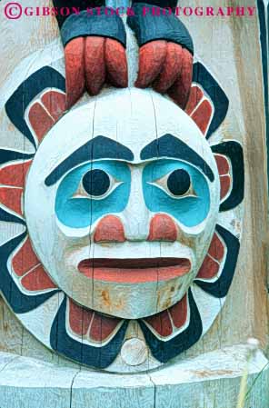 Stock Photo #10470: keywords -  alaska american art artistic carve carved craft crafts display face head heritage historic indian ketchikan native north paint painted pole poles saxman symbol totem tradition traditional vert village wood wooden
