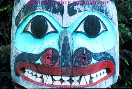 Stock Photo #10471: keywords - alaska american art artistic carve carved craft crafts display face head heritage historic horz indian ketchikan native north paint painted pole poles saxman smile symbol teeth totem tradition traditional village wood wooden