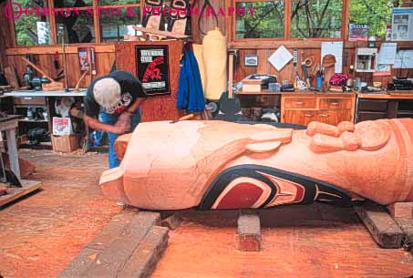 Stock Photo #10472: keywords - alaska american art artistic carve carved carves carving craft crafting crafts craftsman create creating creative heritage horz indian ketchikan native north pole poles saxman skill symbol totem tradition traditional village wood wooden