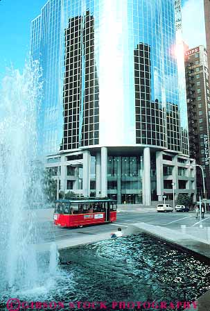 Stock Photo #12320: keywords -  building bus buses cities city design downtown fountain fountains high kansas missouri modern municipal office public reflection reflects rise street streets style transit transportation trolley trolleys urban vert