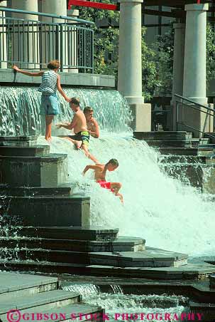 Stock Photo #12257: keywords -  boy boys child children cool flow flowing flows fountain fountains fun gravity group groups hot in kid kids louis memorial missouri municipal people play playing plaza plazas public refreshing saint season st st. summer swim swimming vert warm water youth