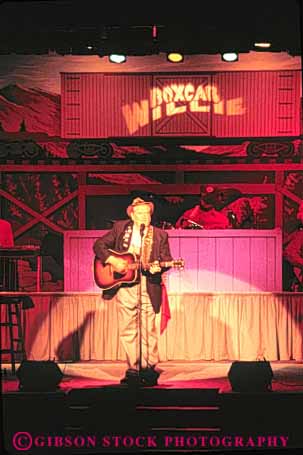 Stock Photo #9522: keywords - act acting actor actors art arts attraction attractions boxcar branson destination display entertain entertainer entertaining entertainment guitar guitarist lighting lights man missouri music musical musician musicians perform performance performers performing present resort resorts show sing singer singers singing solo soloist stage tourist travel vert willie