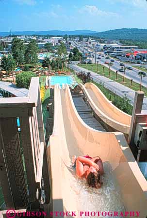 Stock Photo #9523: keywords -  activities activity amusement attraction attractions boy branson child children destination down downward entertain entertaining entertainment fast gravity kid material missouri park parks plastic recreation resort resorts slide slides sliding slip slippery speed summer swim swimming synthetic thrill thrilling tourist travel vert water waters wet white