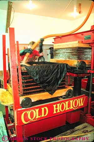 Stock Photo #9334: keywords - apple cider drink england food machine man new press pressure process processing small squeeze squeezes squeezing stowe town vermont vert working