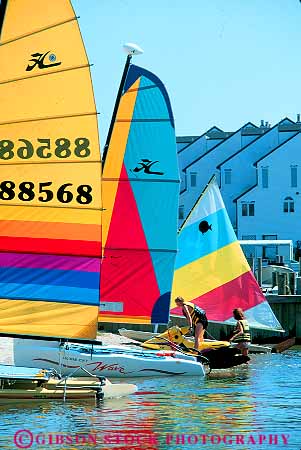 Stock Photo #12364: keywords -  beach boat boats coast coastal color colorful delaware hot material rehoboth rental resort resorts sail sailboat sailboats sailing shape shapes shore strip stripes summer sun sunny sunshine synthetic travel triangle vacation vacations vert warm water