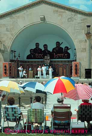 Stock Photo #7768: keywords -  america american annual audience bix building buildings center cities city cityscape cityscapes colorful davenport downtown event festival iowa jazz music musical musician musicians performance performers shade show summer umbrella umbrellas urban usa vert