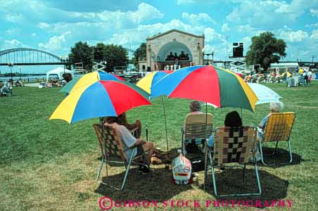 Stock Photo #7769: keywords -  america american annual audience bix building buildings center cities city cityscape cityscapes colorful davenport downtown event festival horz iowa jazz music musical musician musicians performance performers shade show summer umbrella umbrellas urban usa