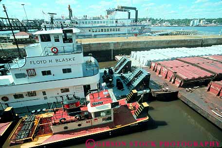 Stock Photo #12210: keywords - (near) barge boat boats commerce davenport equipment fifteen horz industrial industry iowa lock locks mississippi number push pushes pushing river rivers ship shipping through transport transportation tug tugboat water waterway