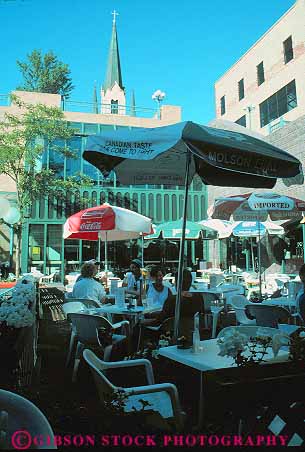 Stock Photo #11855: keywords -  cafe cafes dine dining minneapolis minnesota outdoor outside riverplace social umbrellas vert