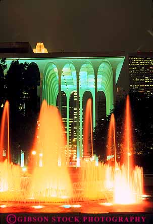 Stock Photo #11860: keywords - bright center color colorful dark downtown evening exposure fountain fountains gateway long minneapolis minnesota night orange splash splashing time urban vert water yellow