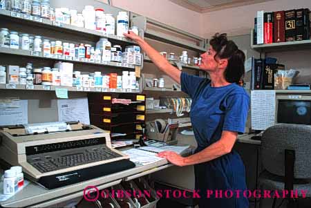Stock Photo #1231: keywords -  care daytime drug drugist drugs education female g happy health horz hospital income inventory job jobs labor medical medicine medicines occupation paycheck pharmacist pill pills prescription prescriptions professional service smile trained woman work worker working