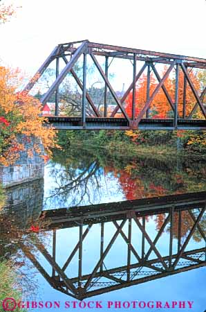 Stock Photo #11007: keywords - across angle angles autumn brace braced bracing bridge bridges calm connect connected connecting connects cross crossbrace crossbraced crosses engineer engineered engineering fall foliage geometric geometrical geometry iron lake lamoille metal morrisville over railroad reach reaches reaching reflect reflecting reflection reflects rigid rigidity river span spanning spans steel still structure support supports transportation triangle triangles vermont vert water
