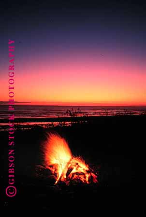 Stock Photo #1236: keywords -  beach campfire campfires dusk fire fires flame heat hot ocean orange outdoor romantic sunset vert