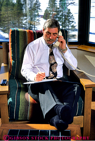 Stock Photo #1246: keywords - business commerce communicate corporate horz hotel in income job man notes occupation office paycheck professional record relax released room smile technology telephone trip works