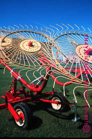 Stock Photo #1258: keywords -  agriculture bright clean color colorful colors crop equipment farm farming harvest implement industry iowa machine metal new paint paiunted round swirl swirls thresh tool tools vert wheel yellow