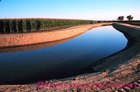 Stock Photo #1269: keywords -  agriculture aqueduct aqueducts bakersfield california canal canals corn downhill farm flow flowing flows gravity horz irrigate irrigates irrigating irrigation management resource transport transporting trench water