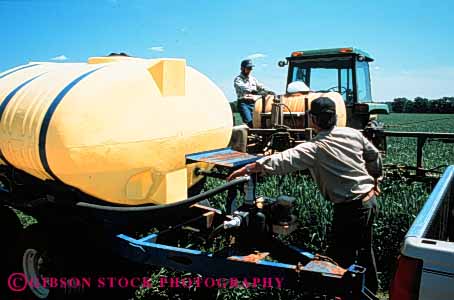 Stock Photo #3303: keywords -  agriculture application charles city crop environment equipment farm field horz malathion men not pesticide poison released spray tank virginia wheat work