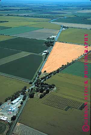 Stock Photo #1296: keywords -  aerial aerials agriculture california crop crossroads elevated farm farmland field fields food geometric grid grow horizon land line linear patchwork produce sacramento sky valley vert