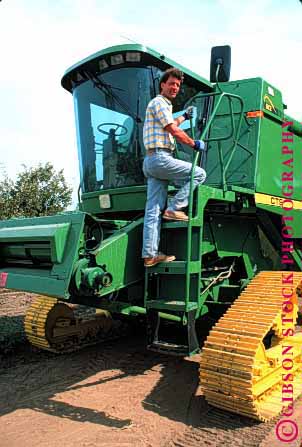 Stock Photo #1300: keywords - big california climb climbing climbs equipment farmer farmers farming harvester heavy in large man men onto people person released tractor tractors up upward vert