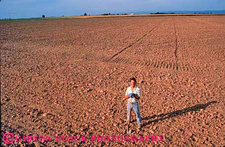 Stock Photo #1306: keywords -  agriculture bare barren big california dirt disked earth employee empty farm farmer farmers farmland field horz in industry job large occupation plowed released soil standing turned unplanted worker