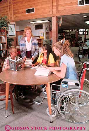 Stock Photo #13380: keywords -  adolescent adolescents african american assist assisting assists black boy career careers chair challenge challenged children disable disabled disadvantage disadvantaged ethnic ethnicity female friend friends gender genders girl girls group groups handicap handicapped help helper helping helps job jobs librarian librarians libraries library male minority mix mixed multi need needs occupation occupations people physical physically read reader reading reads released special table tables talk talking talks teach teacher teachers teaches teaching teen teenage teenager teenagers teens three together vert vocation wheel wheelchair wheelchairs with woman work worker working works young youth