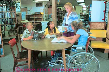 Stock Photo #13381: keywords - adolescent adolescents african american assist assisting assists black boy career careers chair challenge challenged children disable disabled disadvantage disadvantaged ethnic ethnicity female friend friends gender genders girl girls group groups handicap handicapped help helper helping helps horz job jobs librarian librarians libraries library male minority mix mixed multi need needs occupation occupations people physical physically read reader reading reads released special table tables talk talking talks teach teacher teachers teaches teaching teen teenage teenager teenagers teens three together vocation wheel wheelchair wheelchairs with woman work worker working works young youth