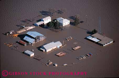 Stock Photo #1322: keywords -  aerial aerials agriculture barn building buildings california claim damage damaged danger disaster disasters farm farmland farms flood flooded flooding floods high home horz house insurance loss mud natural of overflow property rain risk river sacramento valley water weather