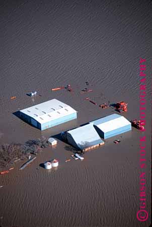 Stock Photo #1323: keywords - aerials agriculture barn building buildings california claim damage damaged danger disaster disasters farm farmland farms flood flooded flooding floods high home house insurance loss mud natural overflow property rain risk river sacramento valley vert water weather
