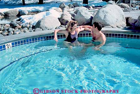 Stock Photo #1333: keywords -  affection close communicate couple horz hot intimate model outdoor private relax released soak spa swim talk together touch tub water winter