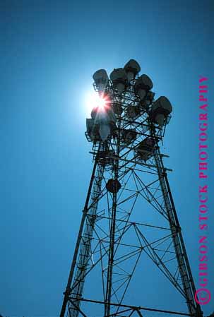 Stock Photo #1345: keywords -  communicate communications industry microwave radio silouette sun technology telecommunicat tower vert