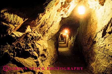 Stock Photo #1352: keywords -  cave claustrophobia dark dig earth environment extract hard hole horz industry metal mine mining resource risk rock scare shaft tunnel