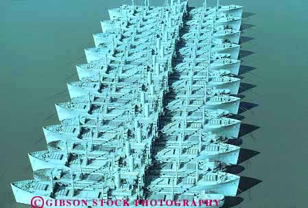 Stock Photo #15799: keywords - aerial aerials anchored bay bizarre california cargo cluster clusters decommissioned different distinct fleet fleets gray group groups horz identical ii liberty lots many military mothball multitude navy numerous old peculiar repeat repeating repeats repetition retired row rows same sameness ship ships side similar storage stored storing strange suisun transport two unique unusual victory vintage war water world