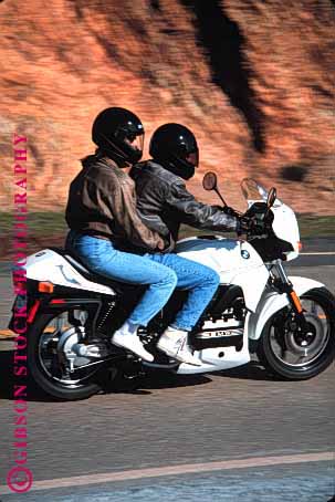 Stock Photo #1355: keywords -  blur carefree country couple cruise drive driver glide helmet motion motorcycle moving passenger ride rural share sightsee steer together tour vacation vehicle vert