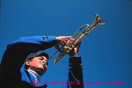 Stock Photo #1360: keywords -  adolescent art blue boy brass coordination finger high horz instrument juvenile learn listen male man music musician practice school skill sound student teach trumpet wind young