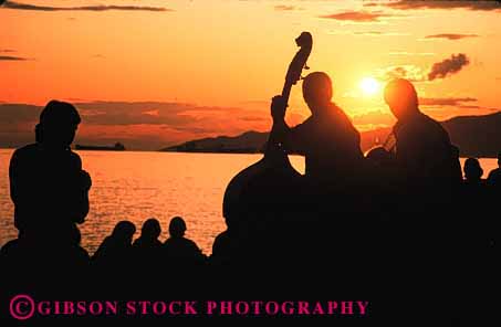 Stock Photo #1361: keywords -  art britsh columbia coordination horz instrument listen music musician musicians outdoor perform practice share skill sound stringed summer sunset together vancouver