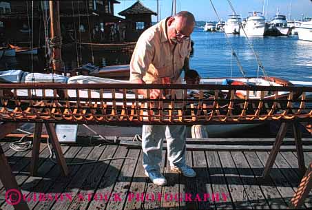 Stock Photo #1386: keywords - assemble boat build center craft eskimo frame heritage horz kayak kit make man maritime not patience released rib seattle skeleton touch umiak wood work