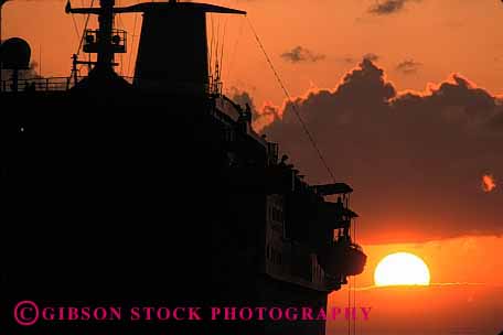 Stock Photo #1392: keywords - cruise gold horz liner ocean orange passenger sea ship silouette sun sunrise sunset travel tropical warm