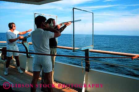 Stock Photo #1395: keywords - adventure boat cruise fun gun horz men noise ocean princess recreation relax rifle royal sea ship shoot sport summer trap travel trip tropical vacation warm