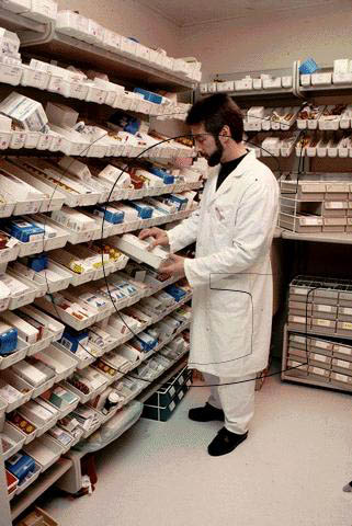 Stock Photo #3511: keywords - business busy career commerce control craft duty earn educated employ employee employment heal hospital inventory job labor man medical medicine occupactions occupation paid pay paycheck payroll pharmacist pills professional released service task technical trade trained treatment vert vocation work worker