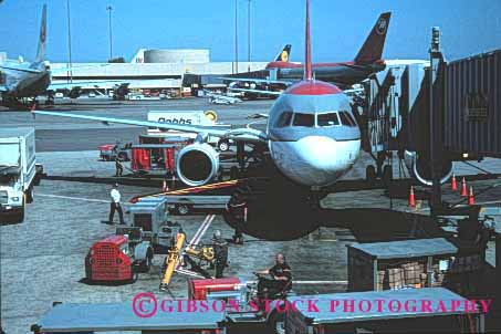 Stock Photo #1432: keywords -  airliner airplane airport change clean fly francisco fuel horz inspect jet luggage maintenance men passenger reload renew san service supply team travel work