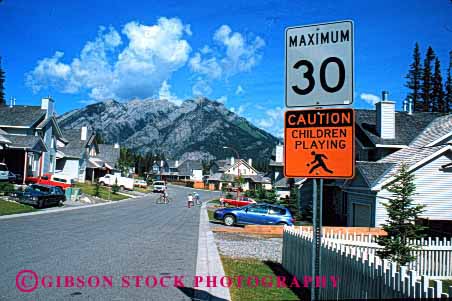 Stock Photo #1461: keywords -  abode banff canada children community dwelling estate expensive family home horz house investment landscape mountain neighborhood outdoor play property quarters real residence residential road safety shelter sign street suburb summer town urban warm