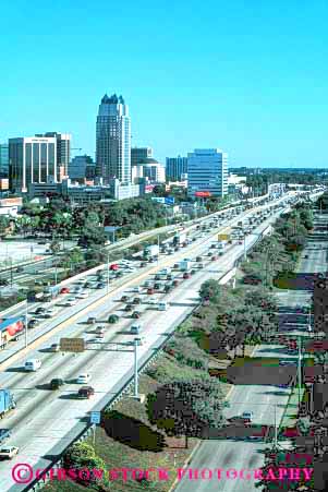 Stock Photo #6064: keywords -  building buildings bumper busy city cityscape commute commuted commuters commuting congested congestion creep divided downtown elevated four heavy highway hour i interstate office orlando pavement road route rush skyline street traffic transportation urban vehicle vehicles vert view