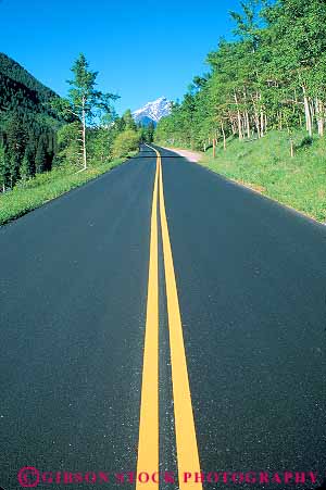 Stock Photo #12634: keywords - asphalt colorado endless horizon in line linear lines mountains parallel pavement road route straight street streets strip strips vert wilderness yellow
